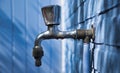 Faucet against a blue wall