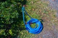 Faucet with blue Hose in garden Royalty Free Stock Photo