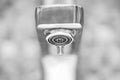 Faucet with dripping water. Tap closeup with dripping water-drop. Water leaking, saving concept