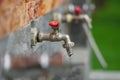 Faucet with red handle Royalty Free Stock Photo