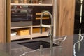 Faucet and sink in a modern, elegant kitchen Royalty Free Stock Photo