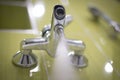 Faucet tap detail in green bathroom Royalty Free Stock Photo