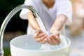 Faucet water and hand Royalty Free Stock Photo