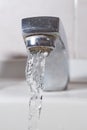 Faucet and water. Open water tap leaking liquid Royalty Free Stock Photo