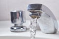 Faucet and water. Open water tap leaking liquid Royalty Free Stock Photo