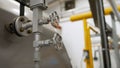 As boiler room, boilers and equipment. Faucet for water supply in a modern boiler room. Heating circulation pumps in Royalty Free Stock Photo