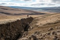 fault line in landscape with person for scale