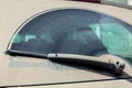 A faulty wiper of a dirty car back window. Royalty Free Stock Photo