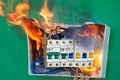 Home electrical fire started in electric fuse box Royalty Free Stock Photo