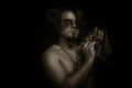 Faun with panflute Royalty Free Stock Photo