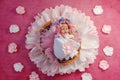 Faux baby reborn, little doll on flower background