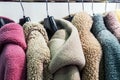 Faux fur coats on a hanger in the store Royalty Free Stock Photo