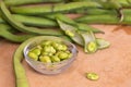 Fava beans on a wooden kitchen table Royalty Free Stock Photo
