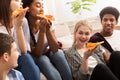 Favorite fast food. Teens eating delicious pizza