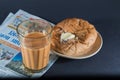 Favorite indian breakfst with tea and bun butter against black background Royalty Free Stock Photo