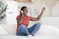 Favorite Pastime. Cheerful Black Woman Listening Music In Wireless Headphones At Home Royalty Free Stock Photo