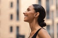 Favorite Playlist. Happy Sporty Woman Listening Music In Earphones While Training Outdoors Royalty Free Stock Photo