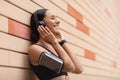 Favorite Playlist. Happy Sporty Young Lady Wearing Headphones Listening Music Outdoors Royalty Free Stock Photo