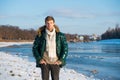 Favorite season is here. guy green puffer coat. man enjoy winter landscape. nature is beautiful. place for thoughts