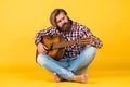 favorite tune. Portrait of happy bearded male playing guitar. a lonely musician. cheerful handsome mature man playing Royalty Free Stock Photo