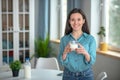 Smiling woman improving her health with milk