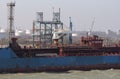 Section of chemical carrier ship discharging cargo at refinery