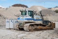 Bulldozer parked in Faxe limestone quarry