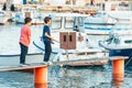 Fazana, Croatia - June 1, 2019: two little boys fishing at sea wooden pier. sea dock Royalty Free Stock Photo