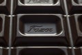Fazer brand name logo imprint on chocolate bar closeup