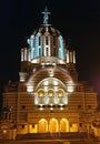 Illuminated facade of the Cathedral of John the Baptist in Fagaras, Romania