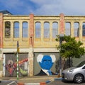 FaÃÂ§ade of the old cinema house with graffiti of Ben Gurion Neve Tzedek Israel