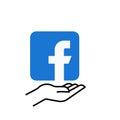 Facebook logo on hand