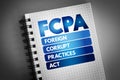 FCPA - Foreign Corrupt Practices Act acronym on notepad, business concept background