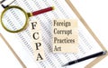 FCPA Foreign Corrupt Practices Act text on wooden block on chart background