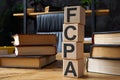 FCPA Foreign Corrupt Practices Act. Wooden cubes with letters on the office table.