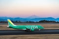 FDA Embraer ERJ-170-100 taxing at dusk Royalty Free Stock Photo