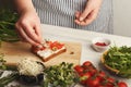 Feamale hands making healthy bruschettas for right snack Royalty Free Stock Photo