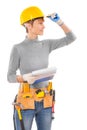 Feamle wearing working clothes with construction tools holding b