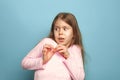 The fear. Teen girl on a blue background. Facial expressions and people emotions concept Royalty Free Stock Photo