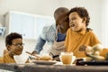 Dad tickling one of his sons with a kiss on the cheek. Royalty Free Stock Photo