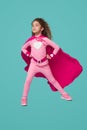 Fearless superhero girl in pink costume Royalty Free Stock Photo