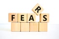 Fears symbol. The concept word `fears` on wooden cubes. Beautiful white table, white background, copy space. Business,