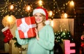 Feast of Christmas. happy new year. Celebrating xmas with family. merry christmas. girl in santa hat present box Royalty Free Stock Photo