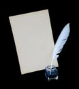 Feather, ink and sheet of old paper Royalty Free Stock Photo