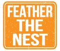 FEATHER THE NEST, text written on orange stamp sign Royalty Free Stock Photo