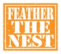 FEATHER THE NEST, text written on orange stamp sign Royalty Free Stock Photo