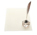 Feather pen with inkwell and blank paper on white background Royalty Free Stock Photo
