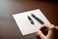A feather quill pen writing into a river of ink Royalty Free Stock Photo