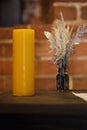 Feather quill pens candle and old paper on wooden desk. Vintage. Royalty Free Stock Photo