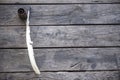 Feather for writing and inkwell .Quill for writing. The feather lies on an old wooden table with inkwell . Beautiful background Royalty Free Stock Photo